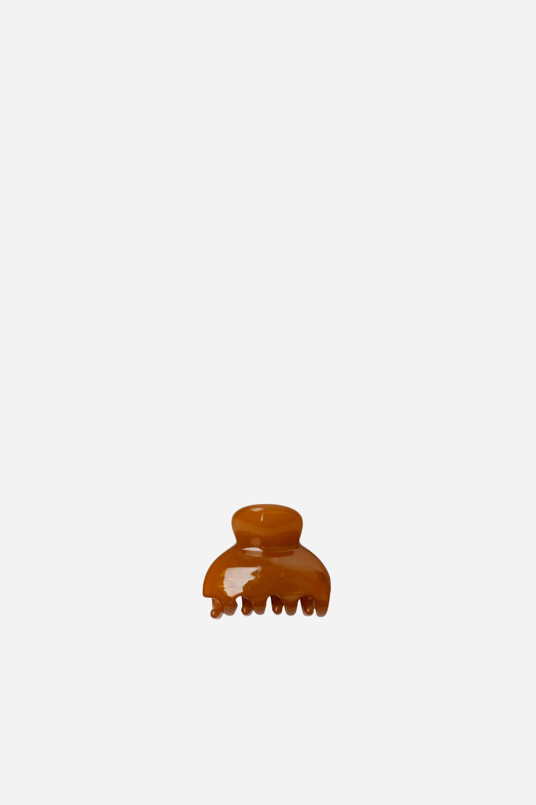 mustard hair clip on a white background