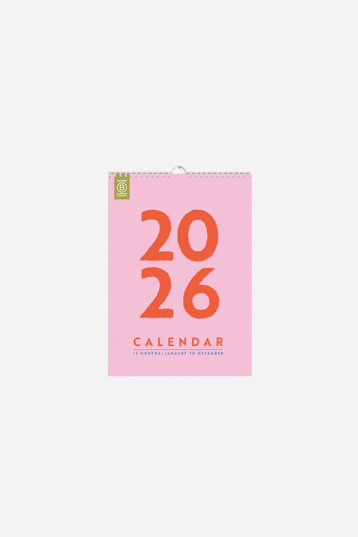 Pink wall calendar on white backround