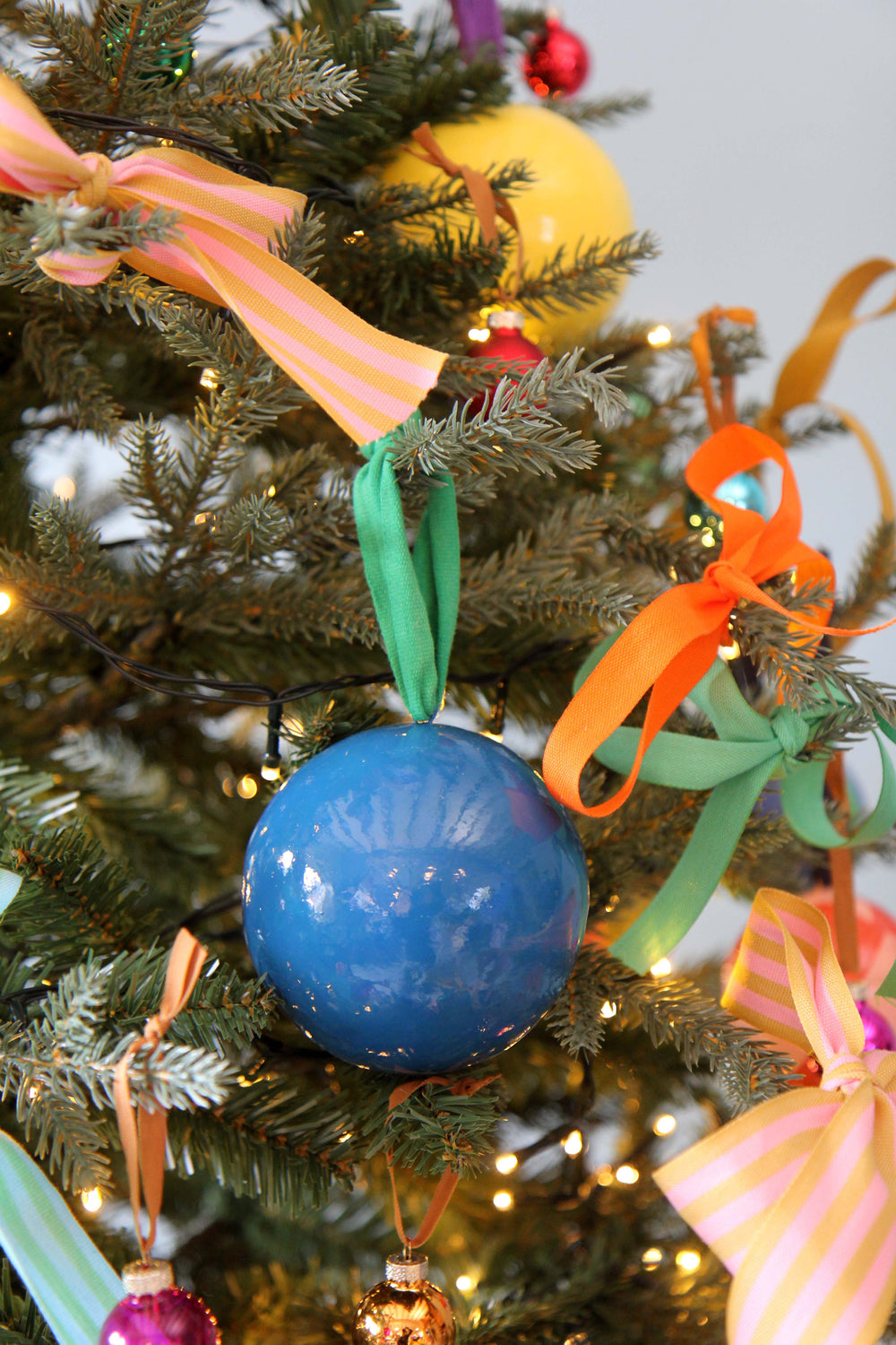 Decorative Christmas tree with colorful ornaments and ribbons