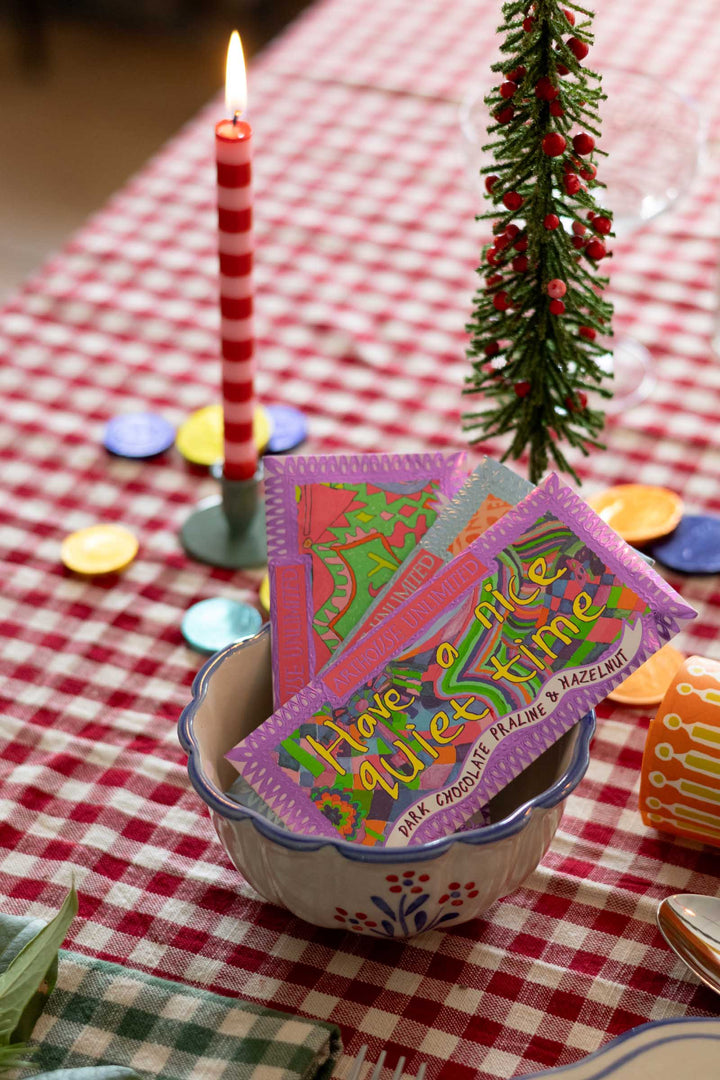 Two colorful candy bars labeled &