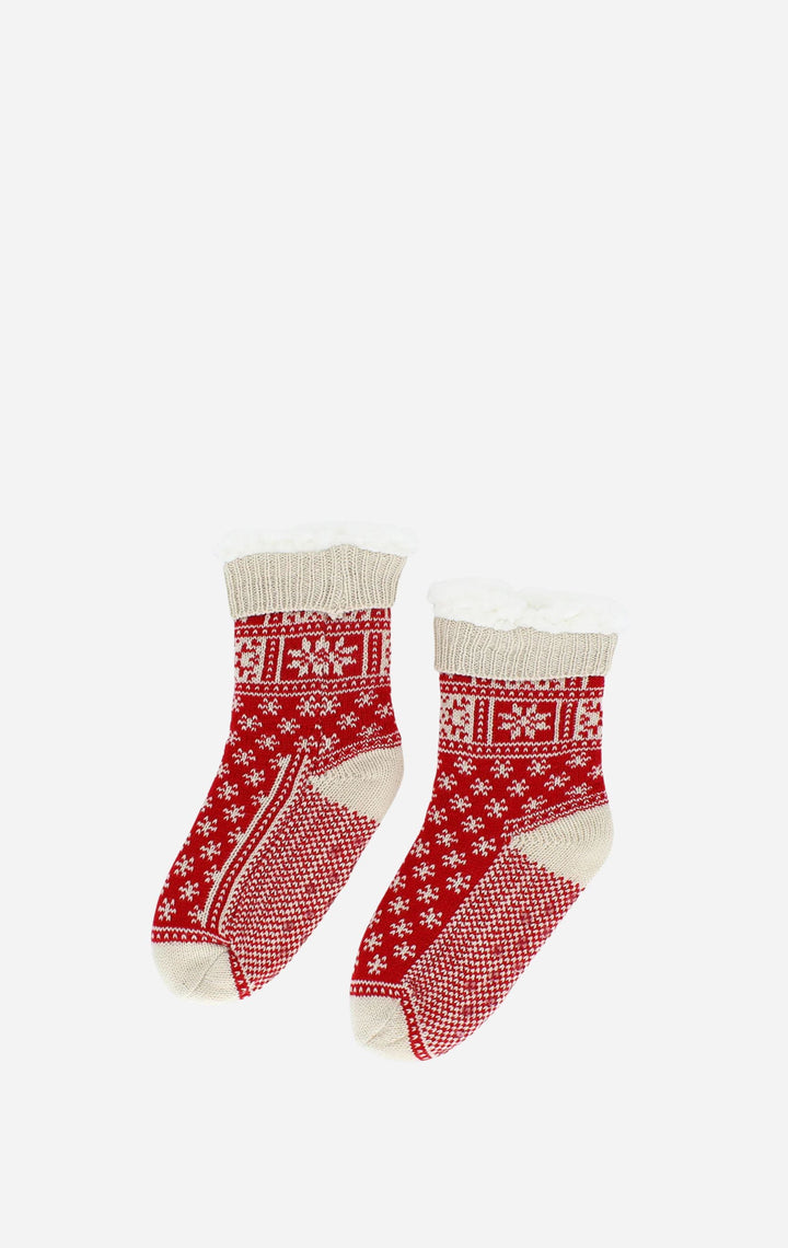 Pair of red and white patterned socks on a white background