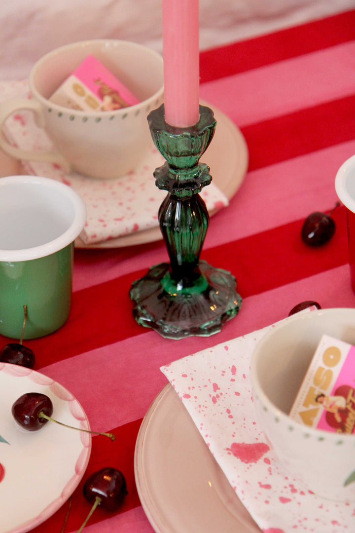 Cherry coded tablescape green glass candle stick with pink candle