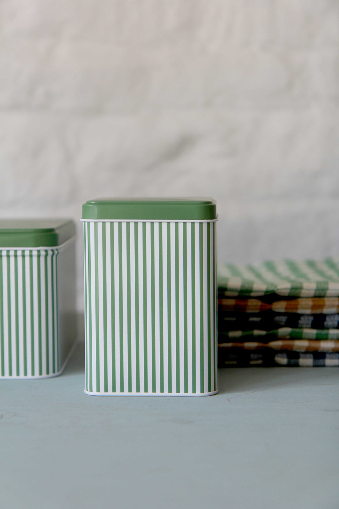 Green tall striped canister