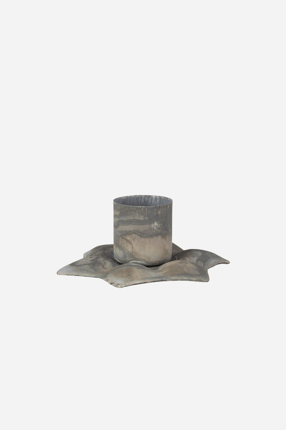 A small star sculptural metal candle holder 