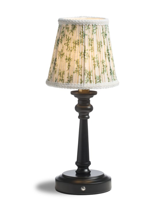 Table lamp with a decorative lampshade on a white background