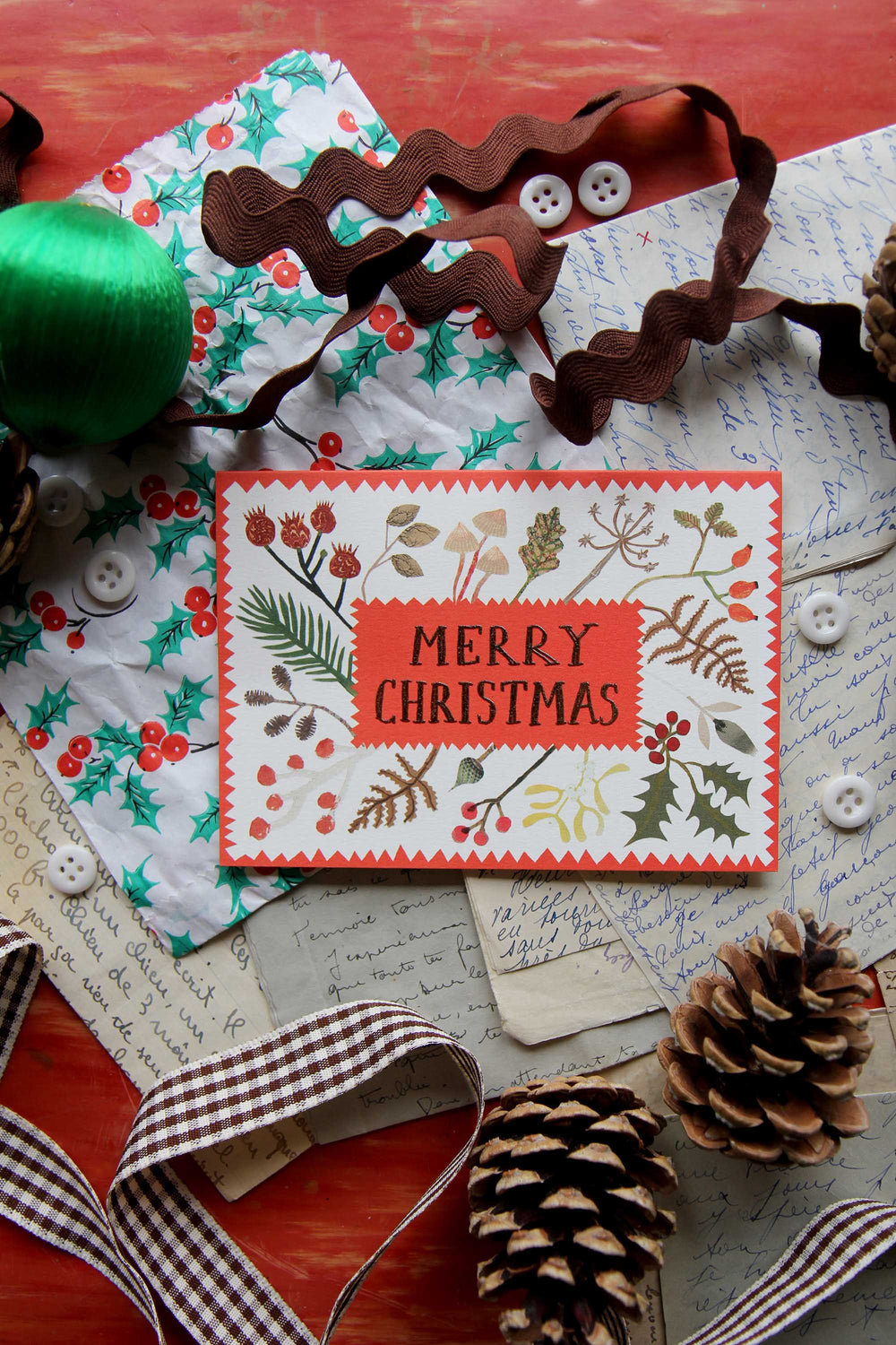 Christmas card with decorative elements on a rustic background