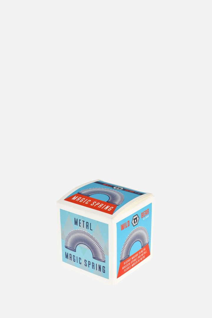 Box of a metal magic spring on a white background