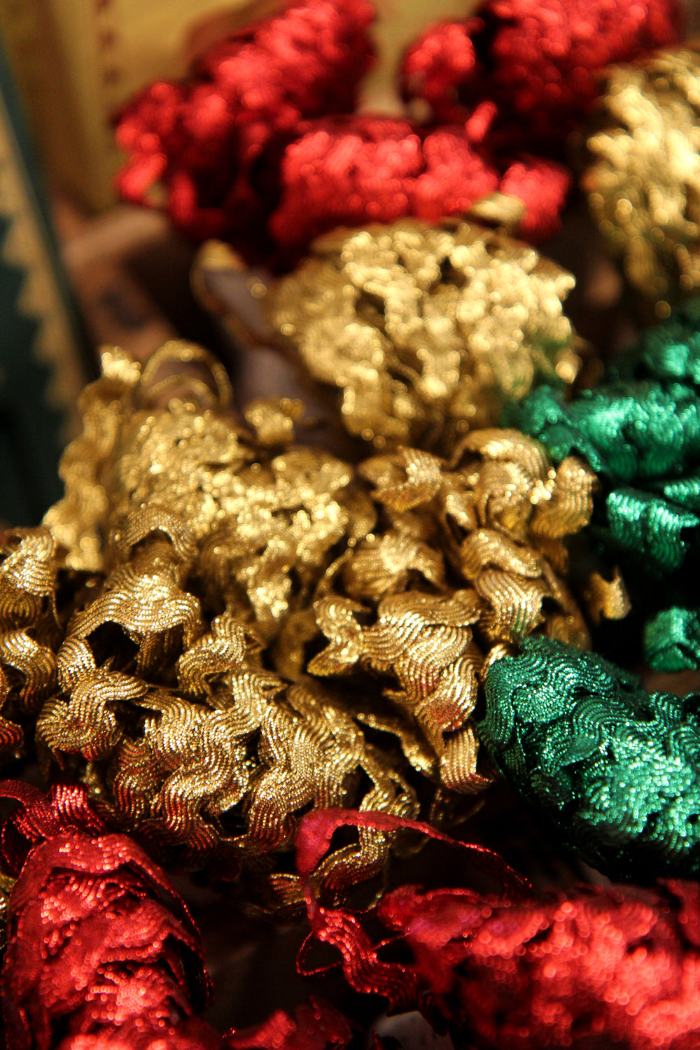 Close-up of red, gold, and green decorative ribbons.