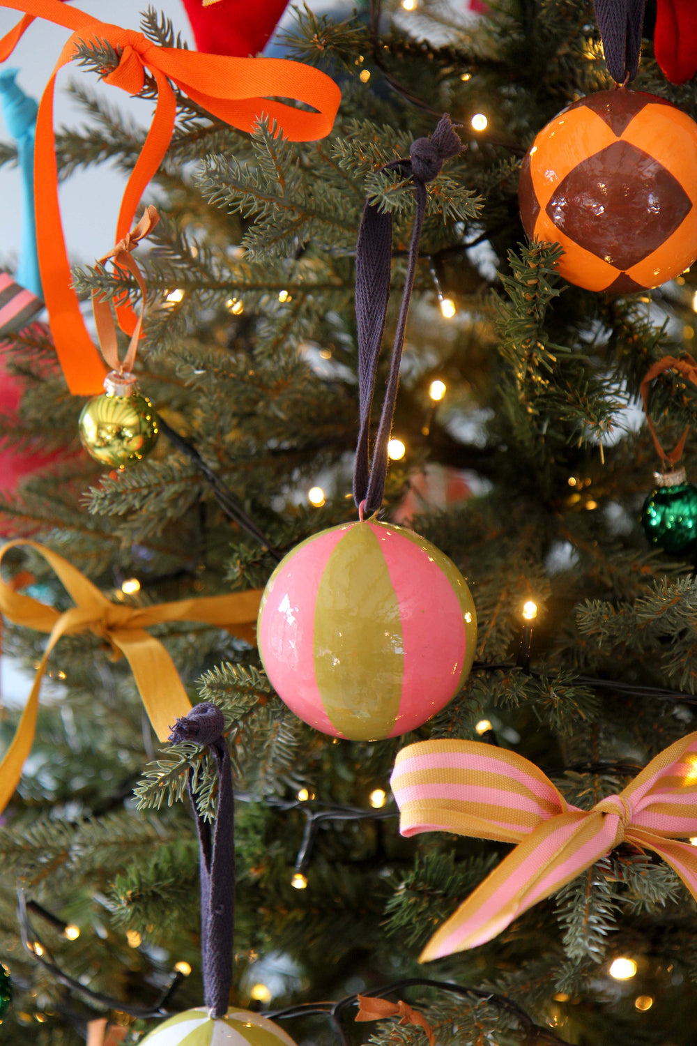 Decorative Christmas tree with colorful pink and green ornament and lights