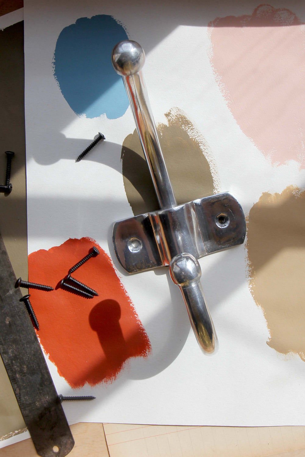 Metal toggle bolt on a colorful background