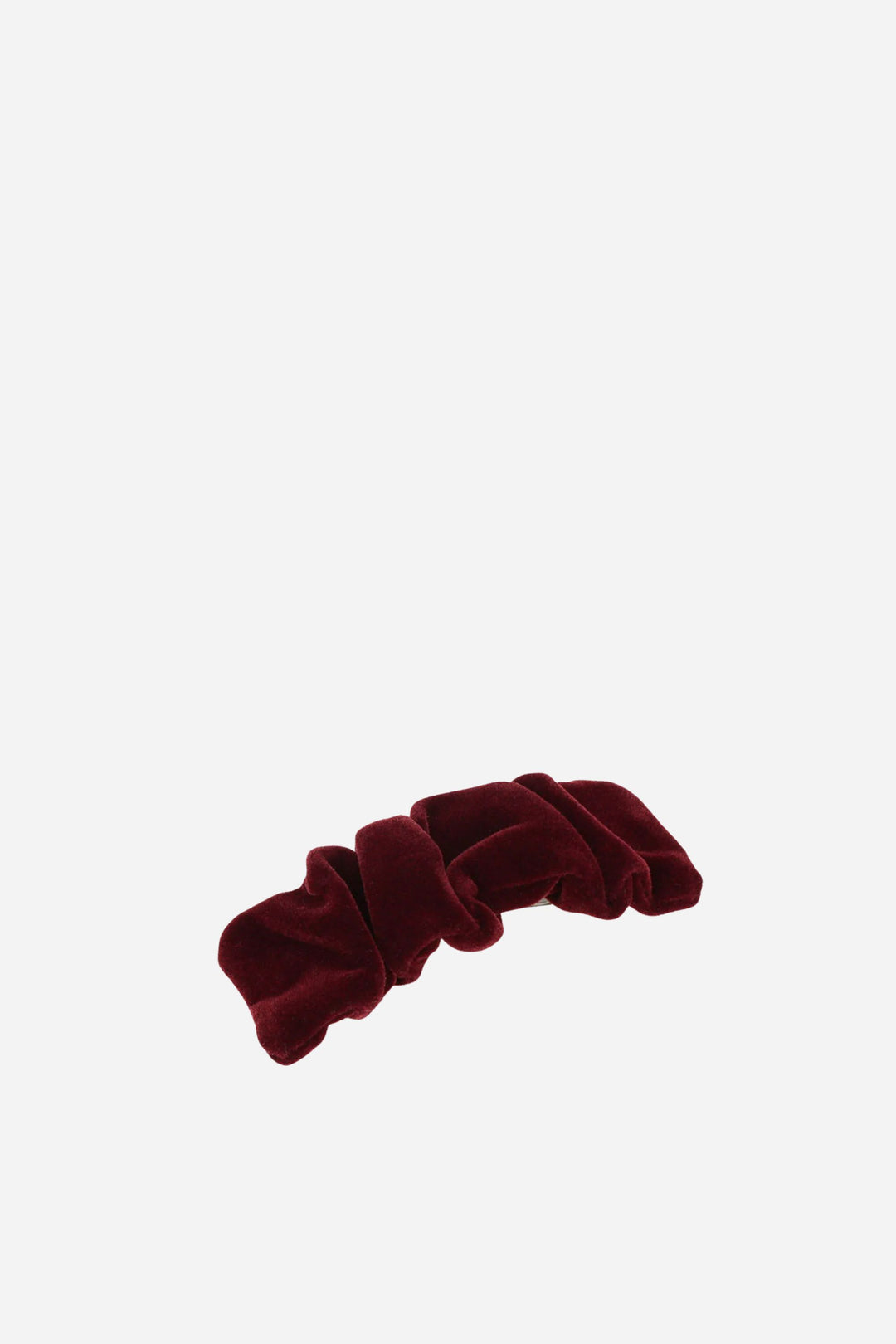 Red velvet scrunchie on a white background