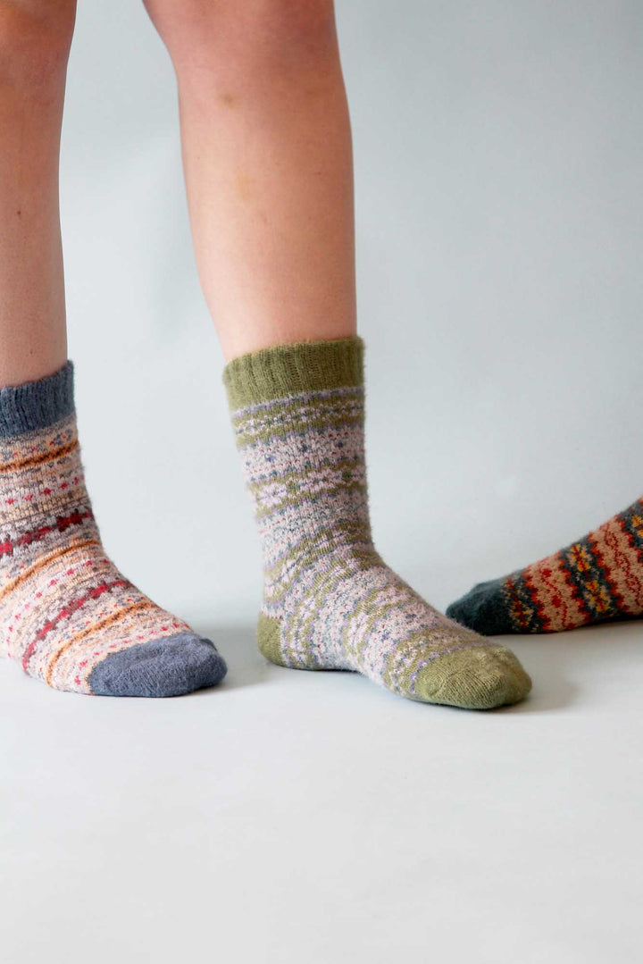 Colorful patterned socks on a plain background