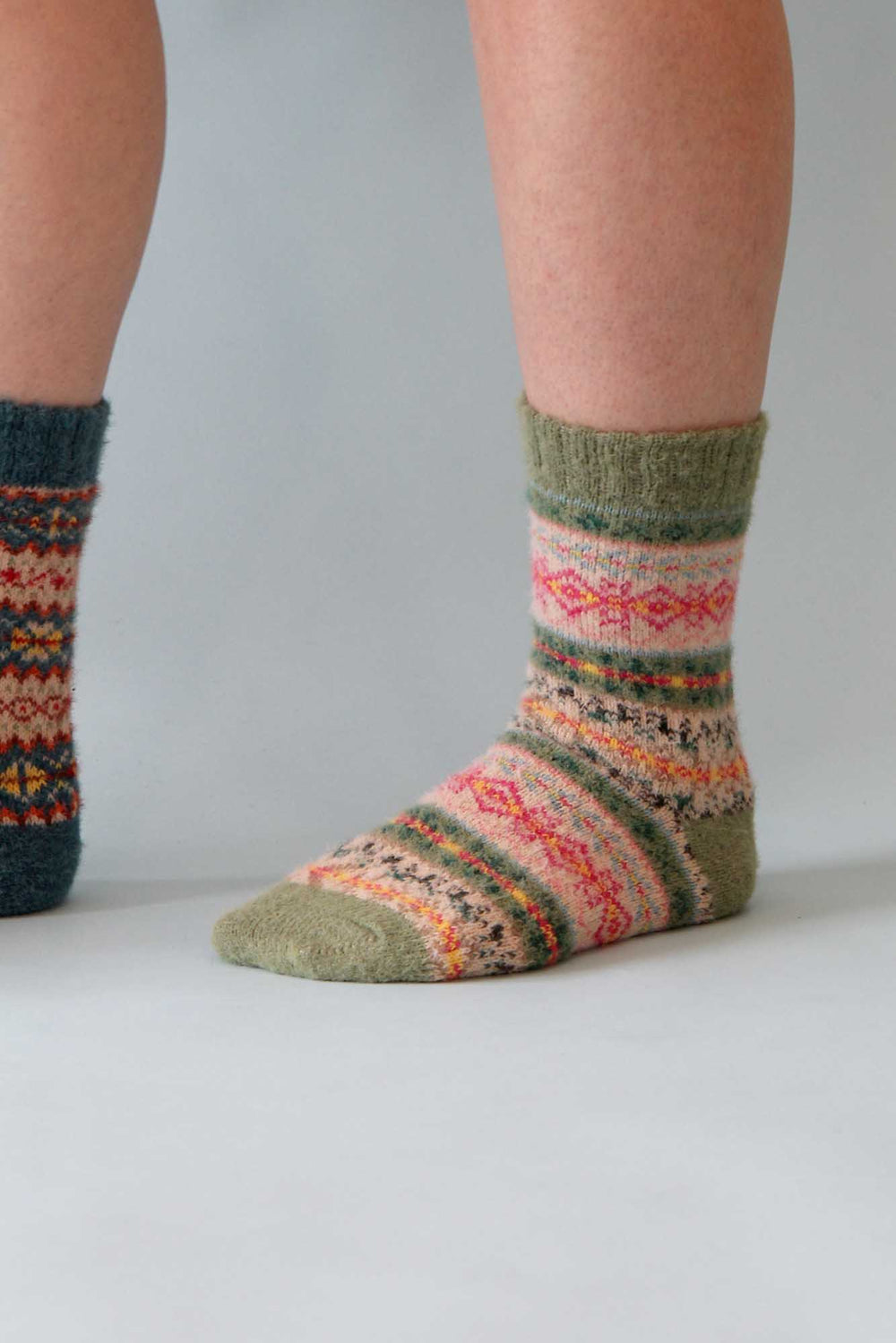 Colorful patterned socks on a plain background