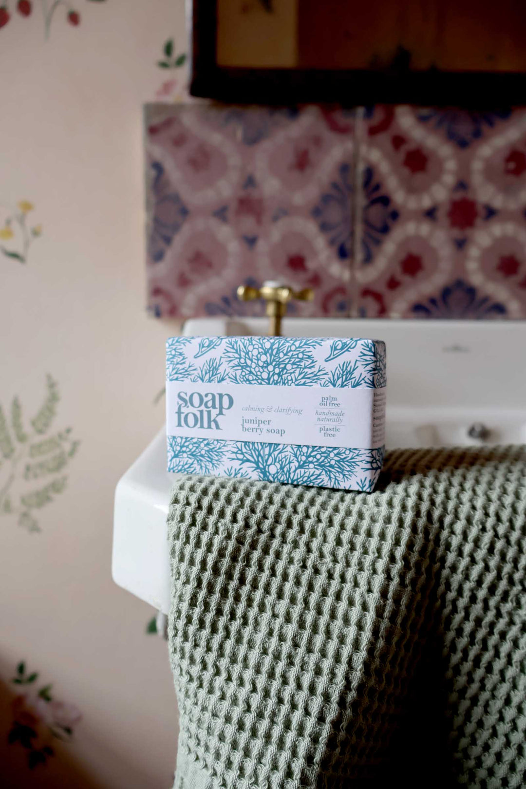 Box of Soap Folk soap on a sink with decorative tiles in the background