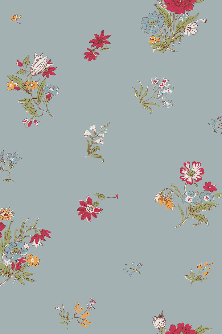 A repeating floral wallpaper on a muted duck-egg-blue background, featuring small clusters of red, pink, white, yellow, and blue flowers with green stems and leaves.