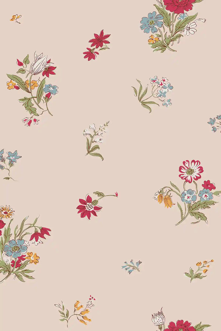 A repeating floral wallpaper on a warm powder pink background, featuring small clusters of red, blue, yellow, white, and orange flowers with green stems.