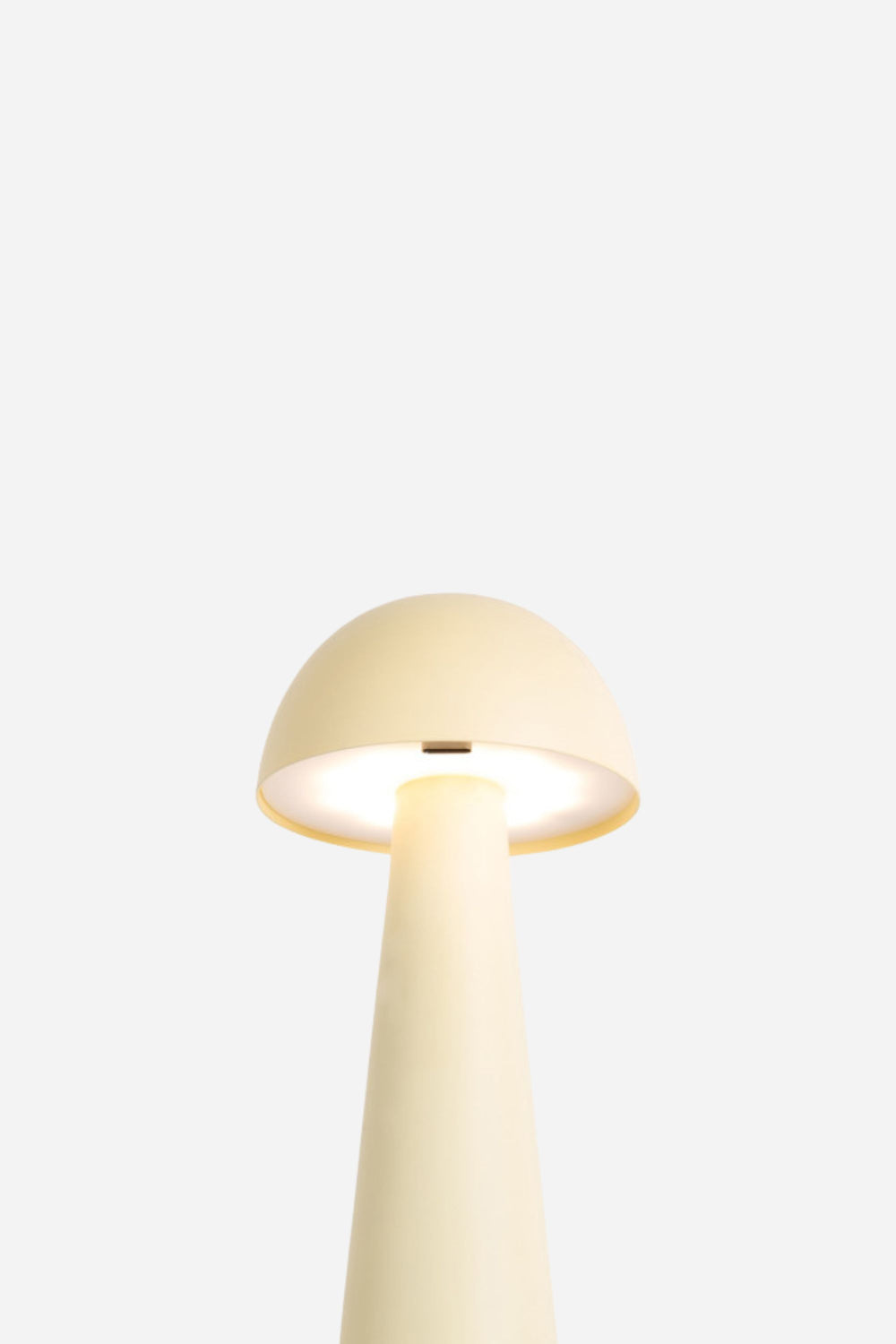 Yellow mushroom-shaped lamp on a white background