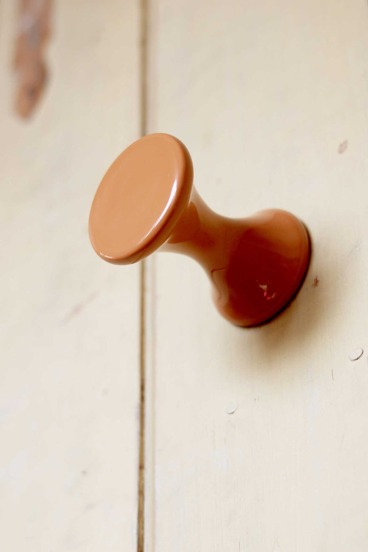 Brown door handle on a wooden door