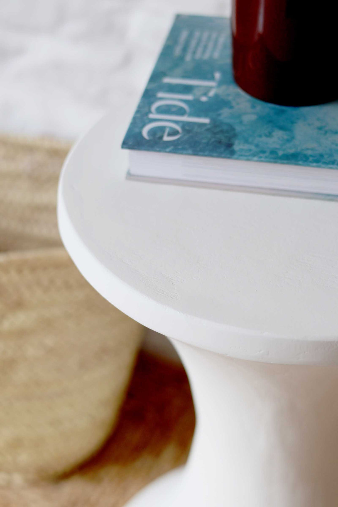 Close-up of a Tide detergent box on a white surface with a blurred background