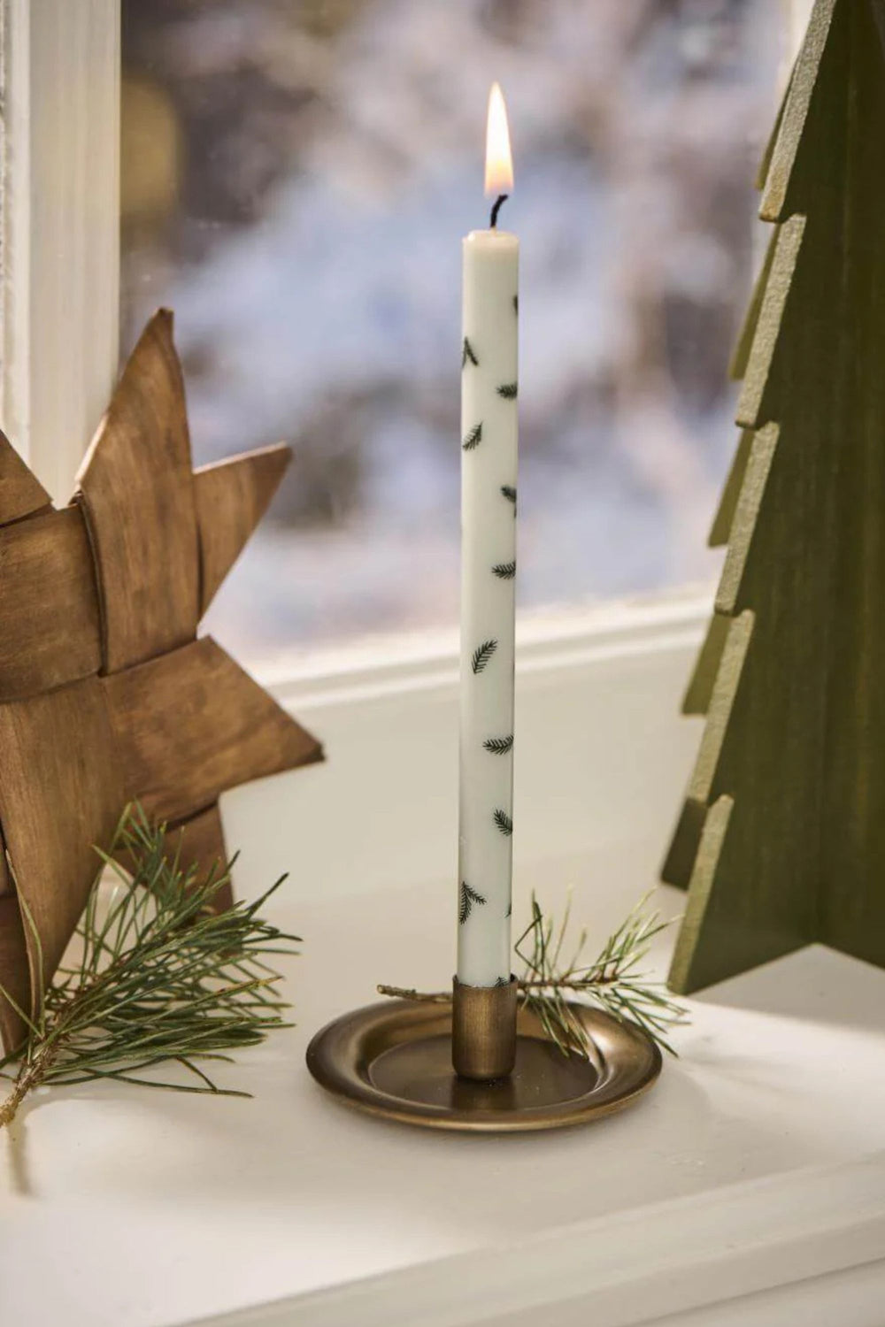 Green Taper Candle with twig pattern in candle holder