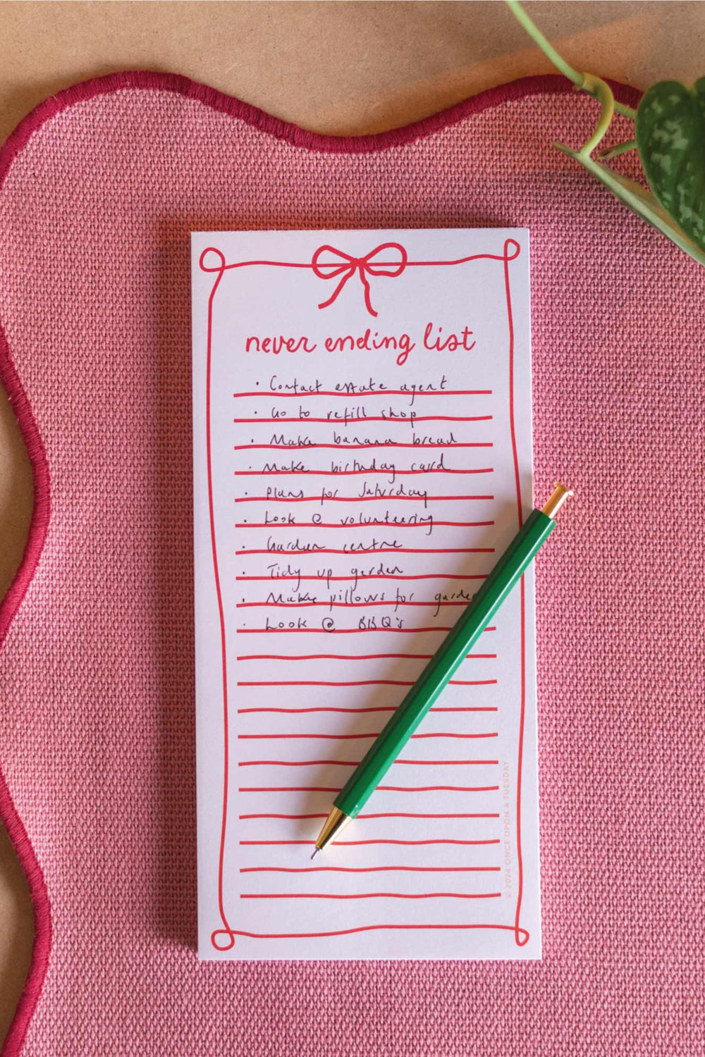 notepad on pink placemat