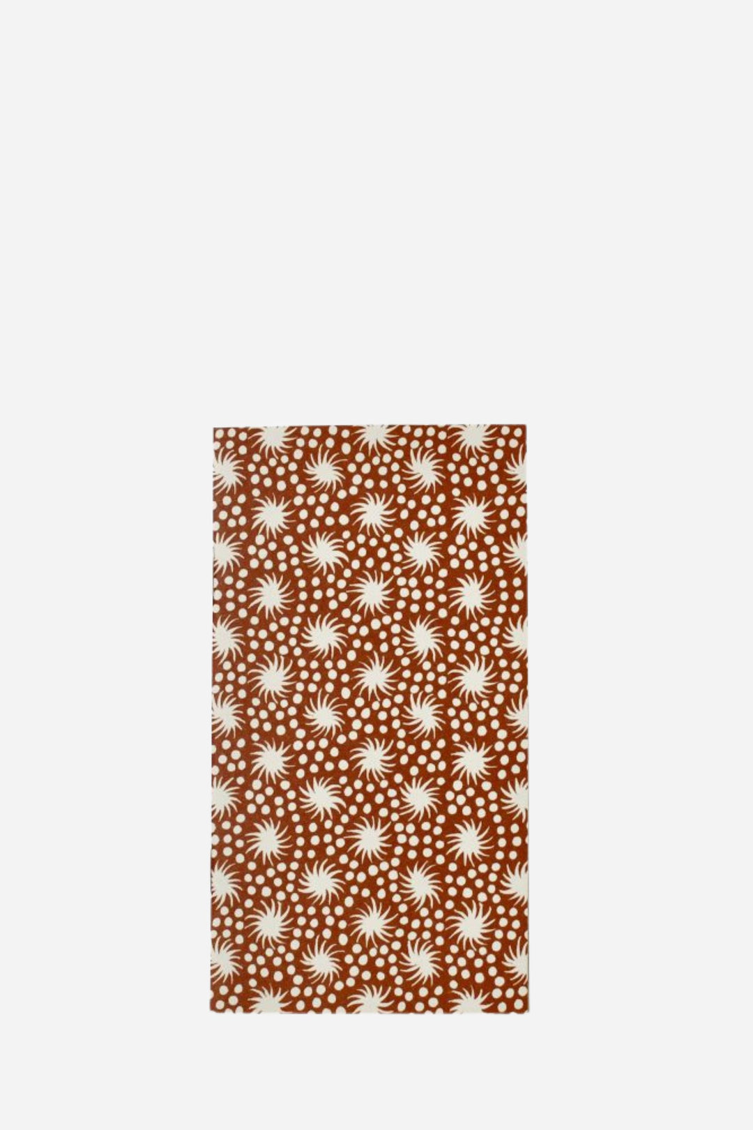 Patterned fabric with white starburst design on a brown background