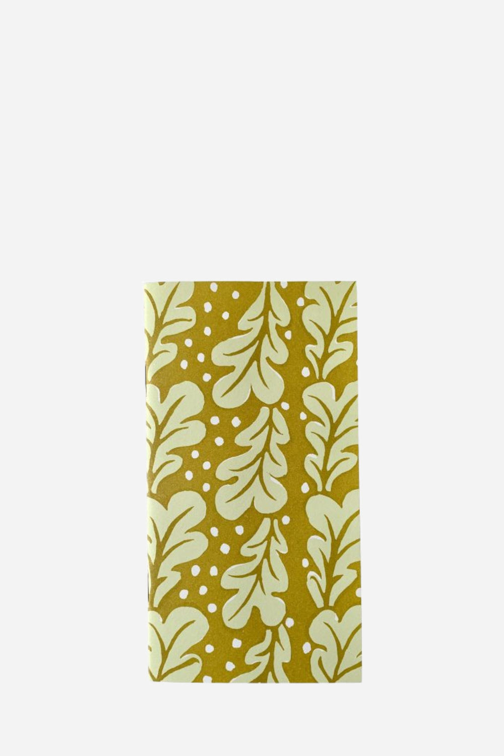 Notebook with leaf pattern on a mustard yellow background