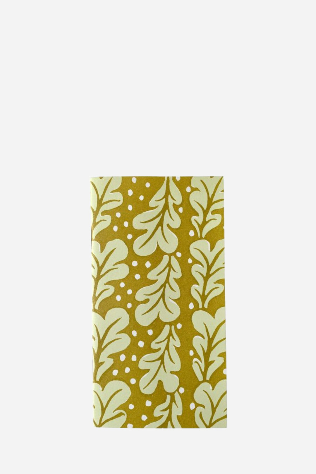 Notebook with leaf pattern on a mustard yellow background