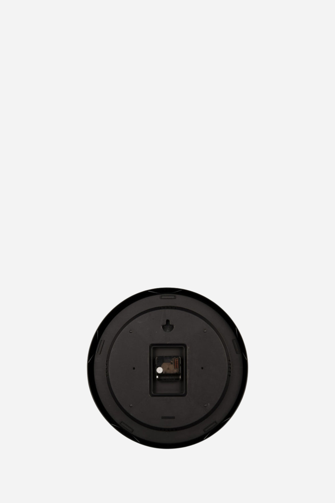 back of clock in front of white backround