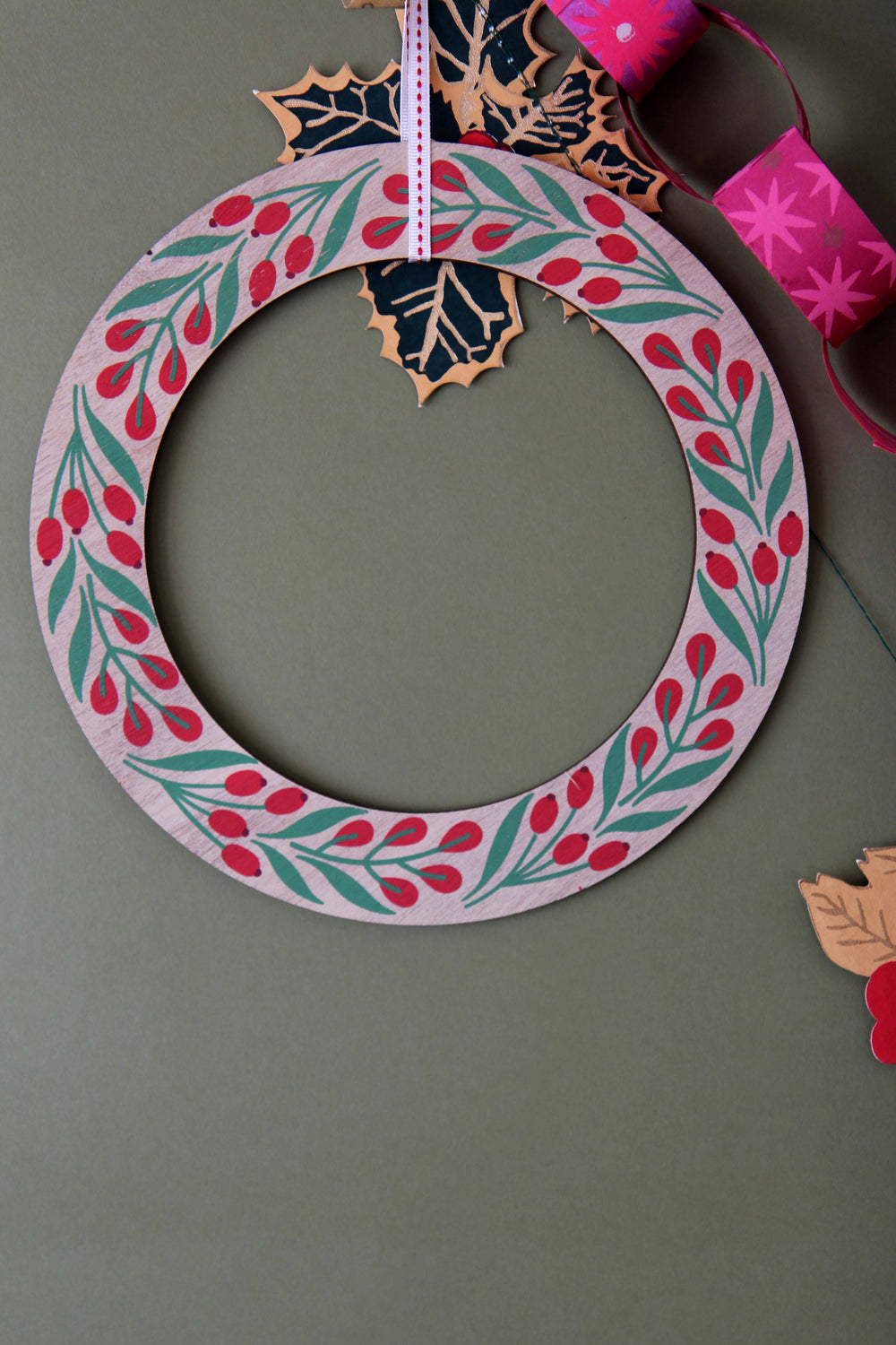 Decorative wreath with floral patterns on a plain background