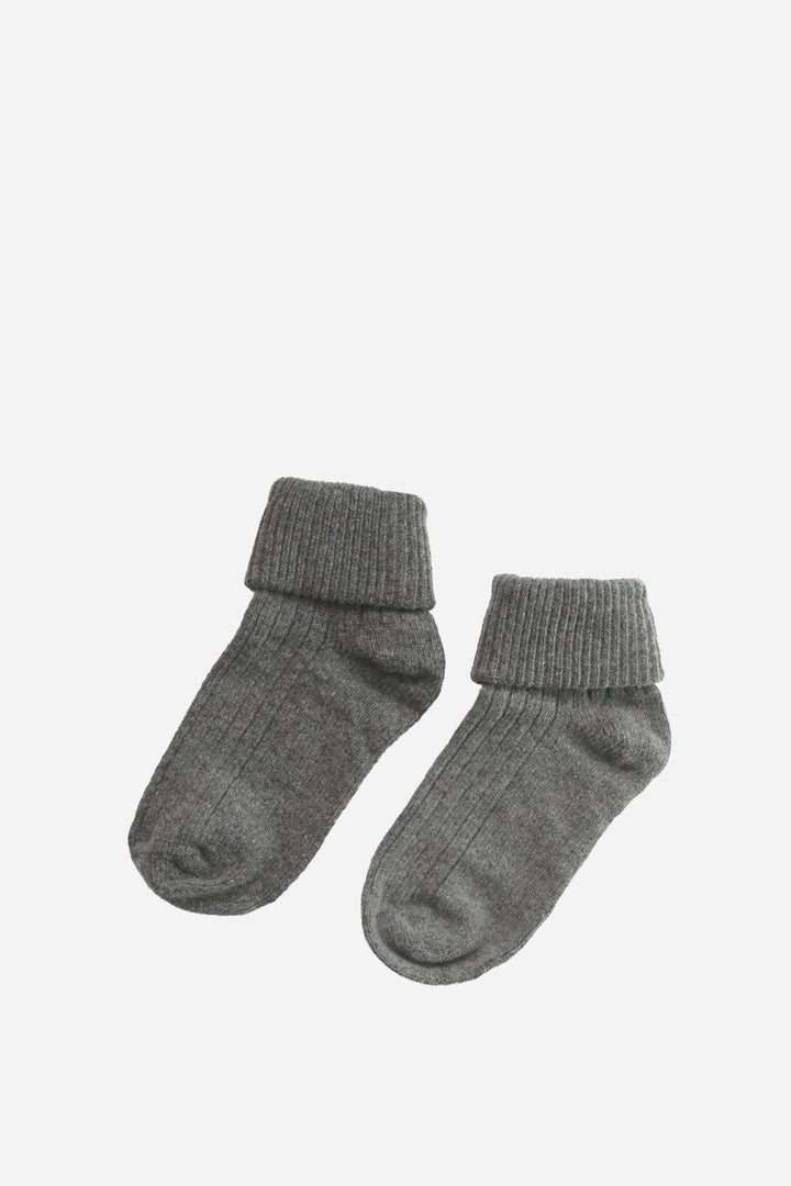 Pair of gray socks on a white background