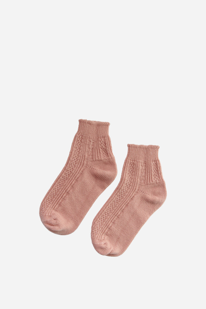 Pair of pink socks on a white background