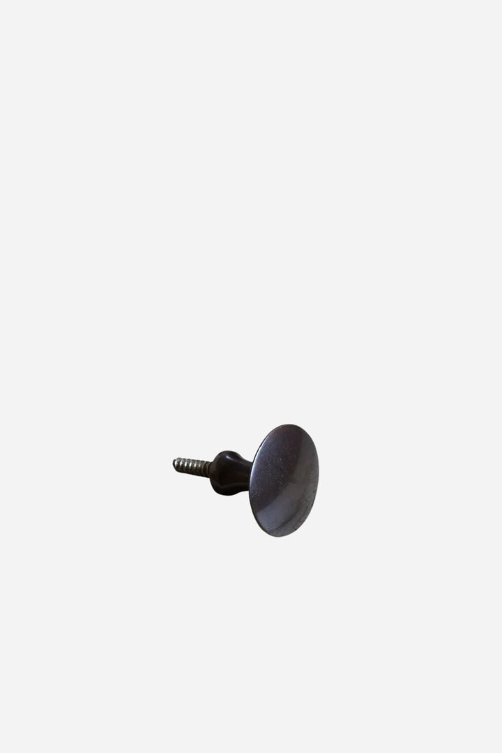 Black knob on a white background