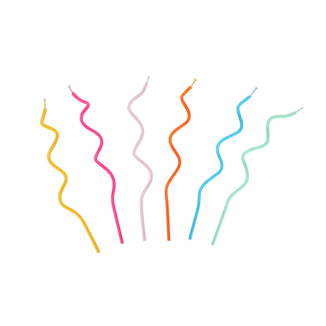 Set of colorful wavy candles on a white background