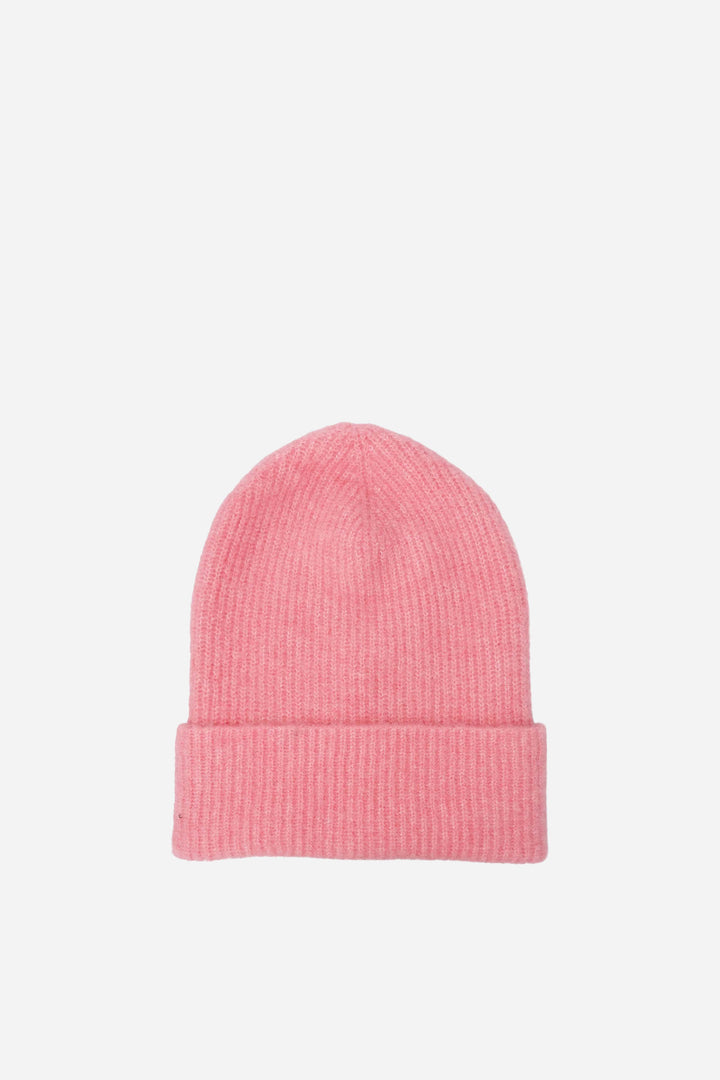 Pink beanie on a light pink background