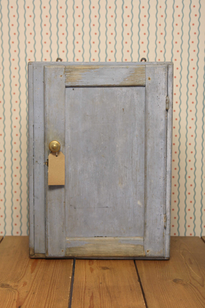 blue painted small bathroom cabinet