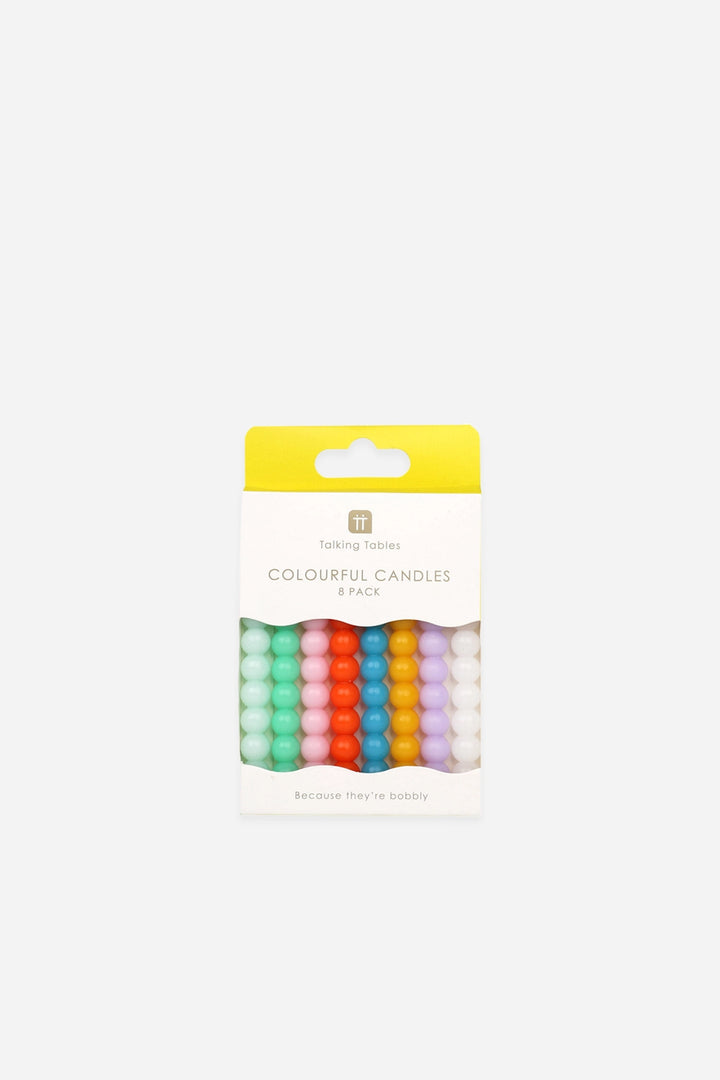 Pack of colourful bobble candles on a white background