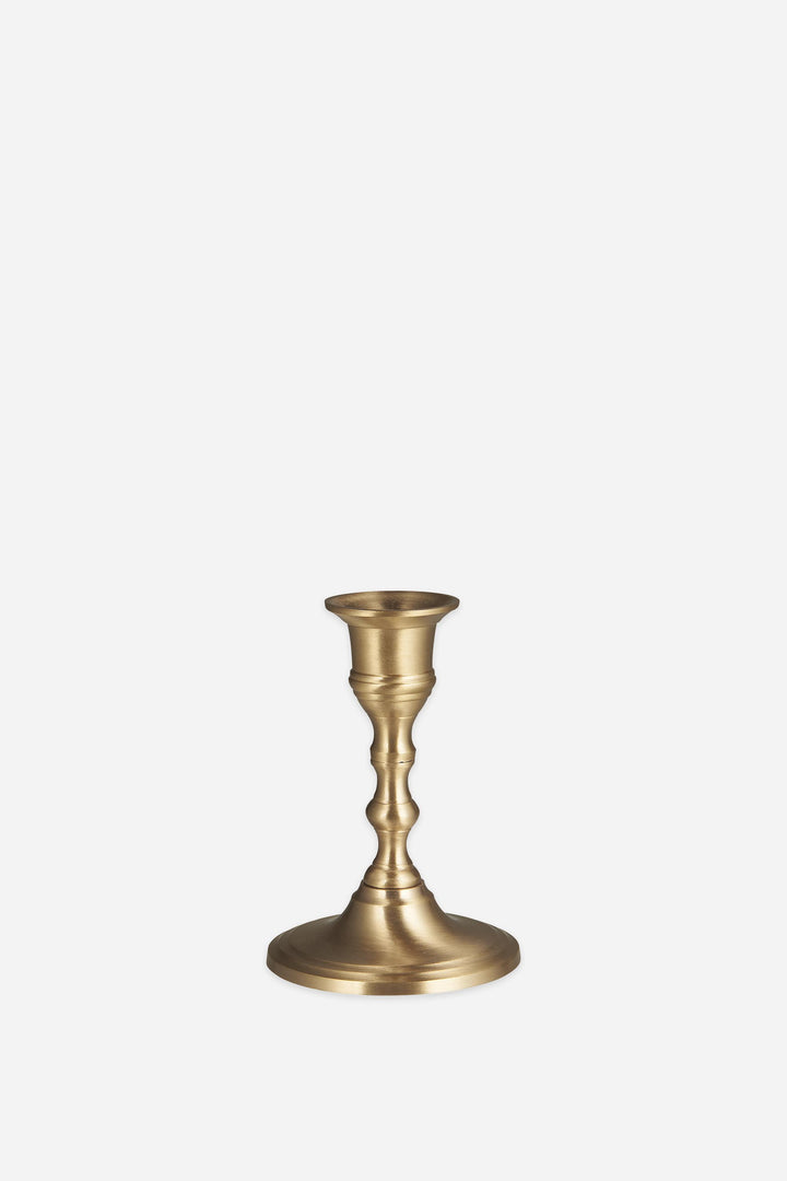 brass candle holder on a white background