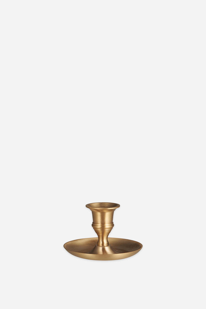 Brass candle holder on a white background