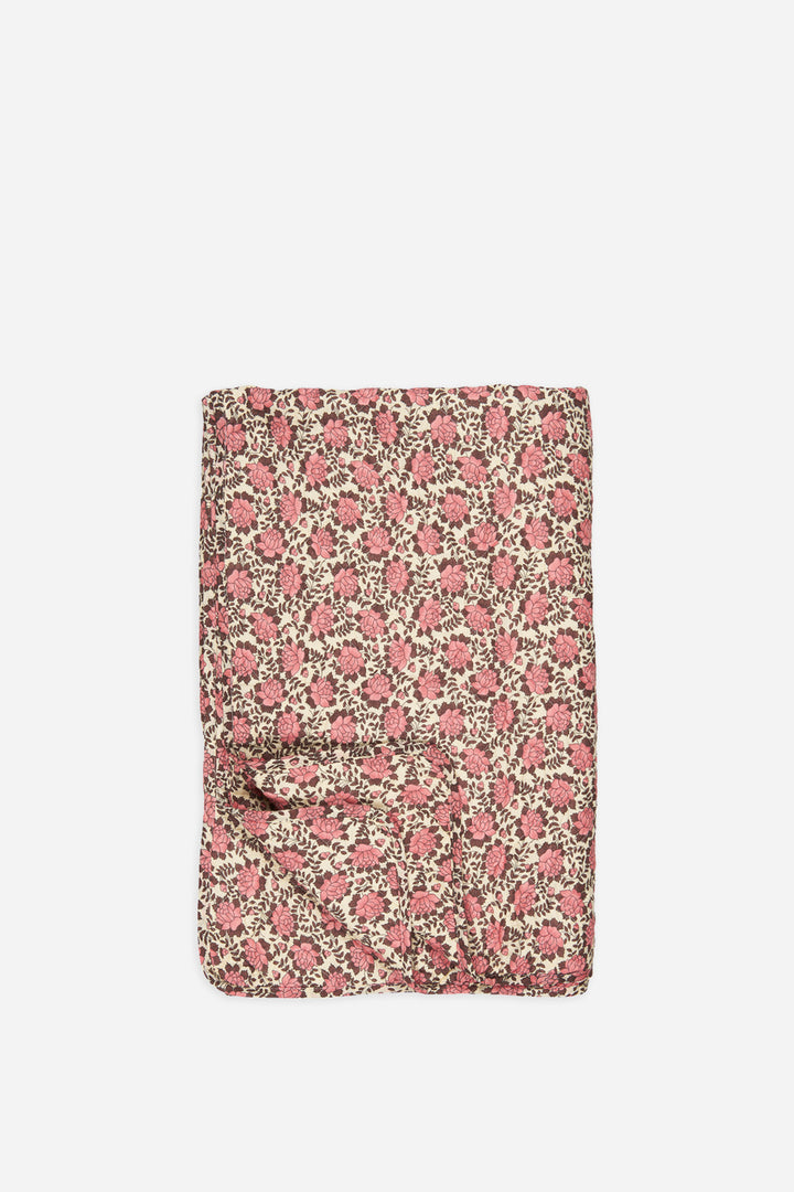 brown and pink floral quilt