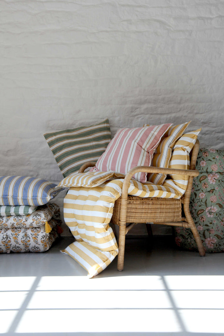 pile of bungalow dk garden soft furnishings, striped mattresses and seat cushions