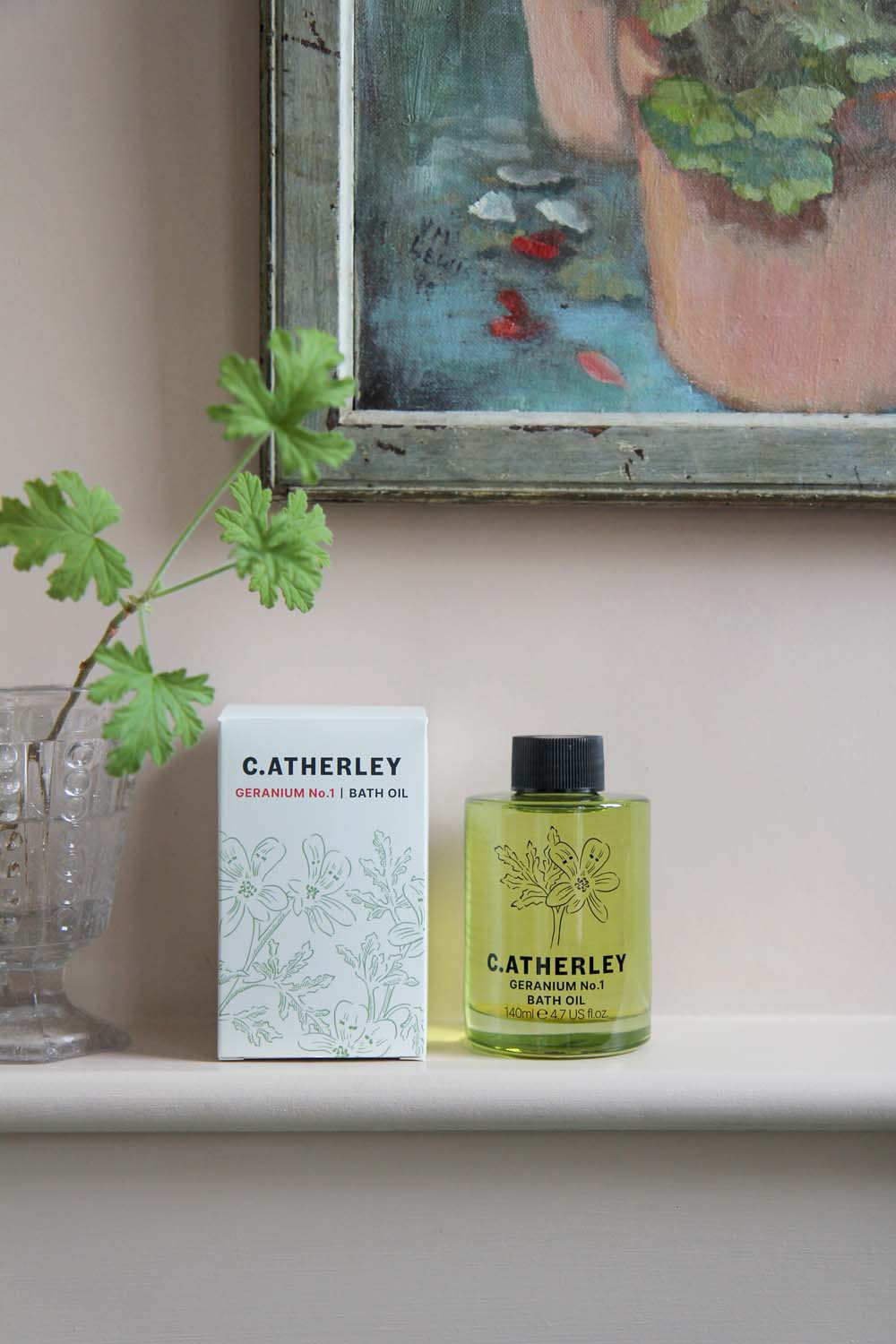 c.atherley geranium bath oil green glass bottle on shelf