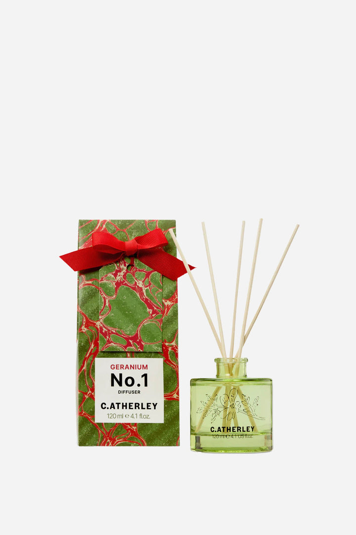 Catherley No.1 diffuser with green bottle and red ribbon on a white background