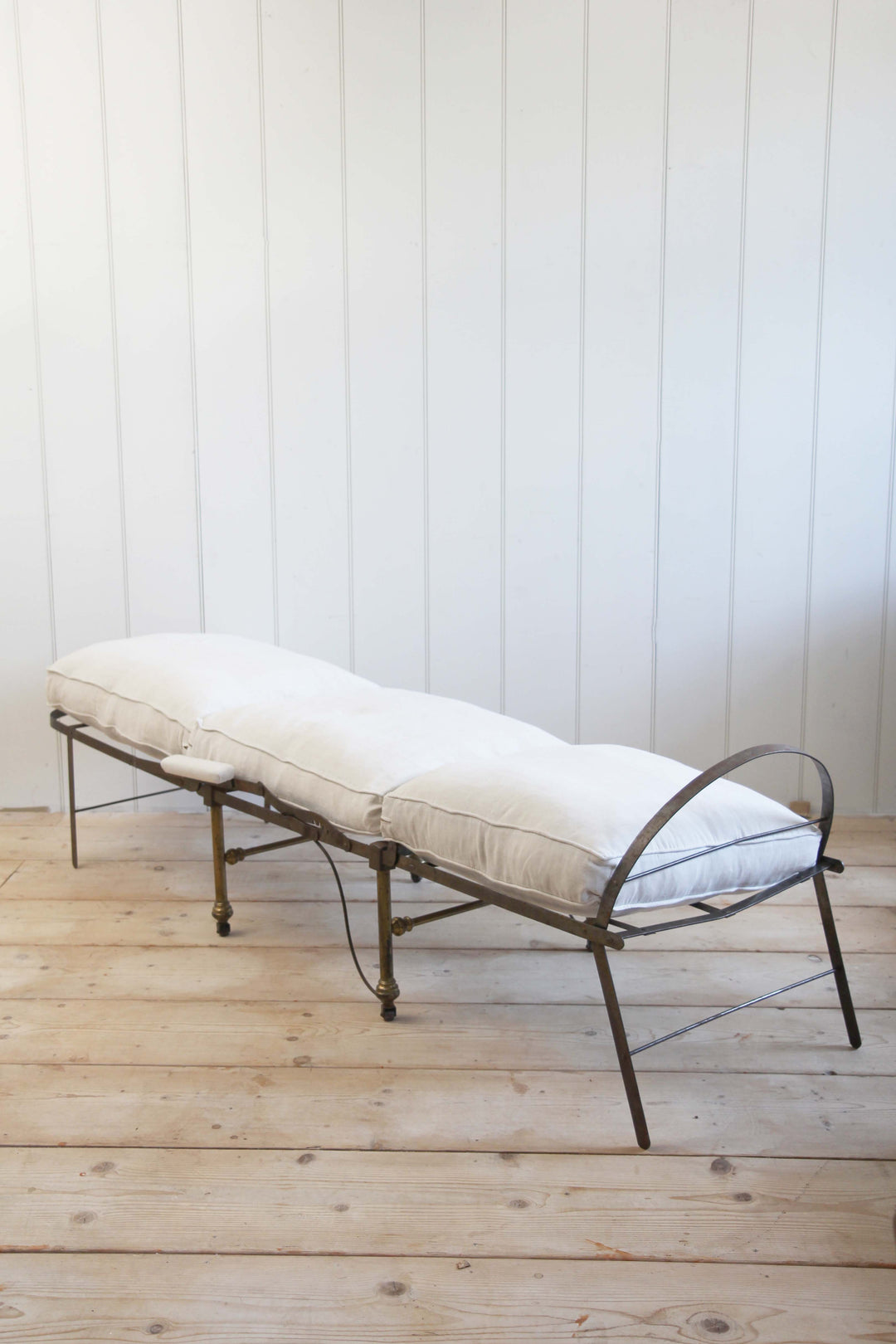 vintage campaign chair upholstered in cream canvas fully extended into bed