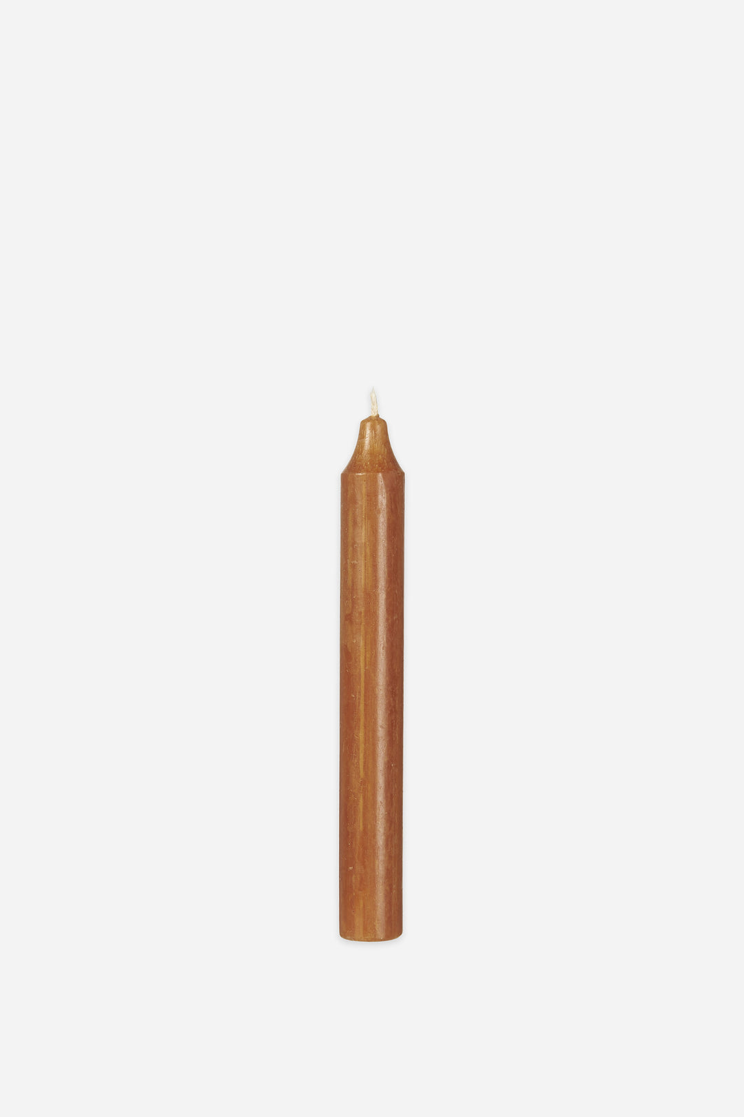Brown candle on a white background