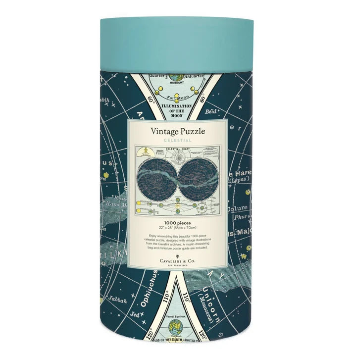 A cylindrical puzzle box with a teal lid and a dark blue star map design. The front label reads &