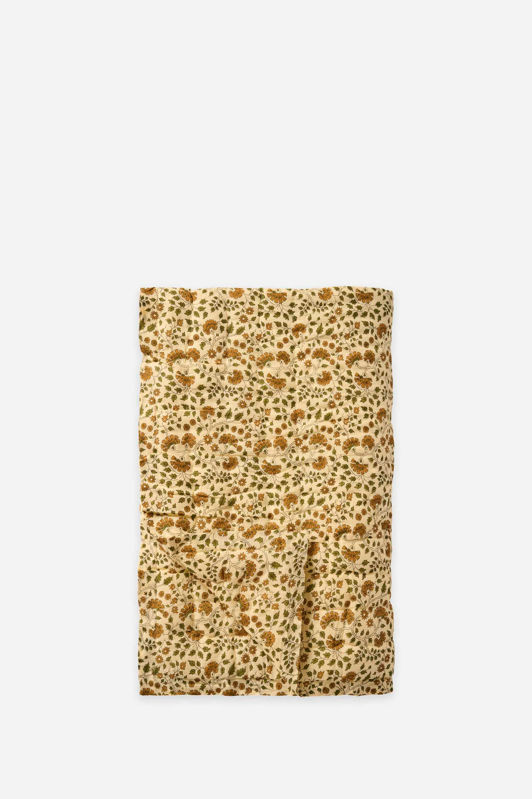 floral print patterned quilt on a beige background