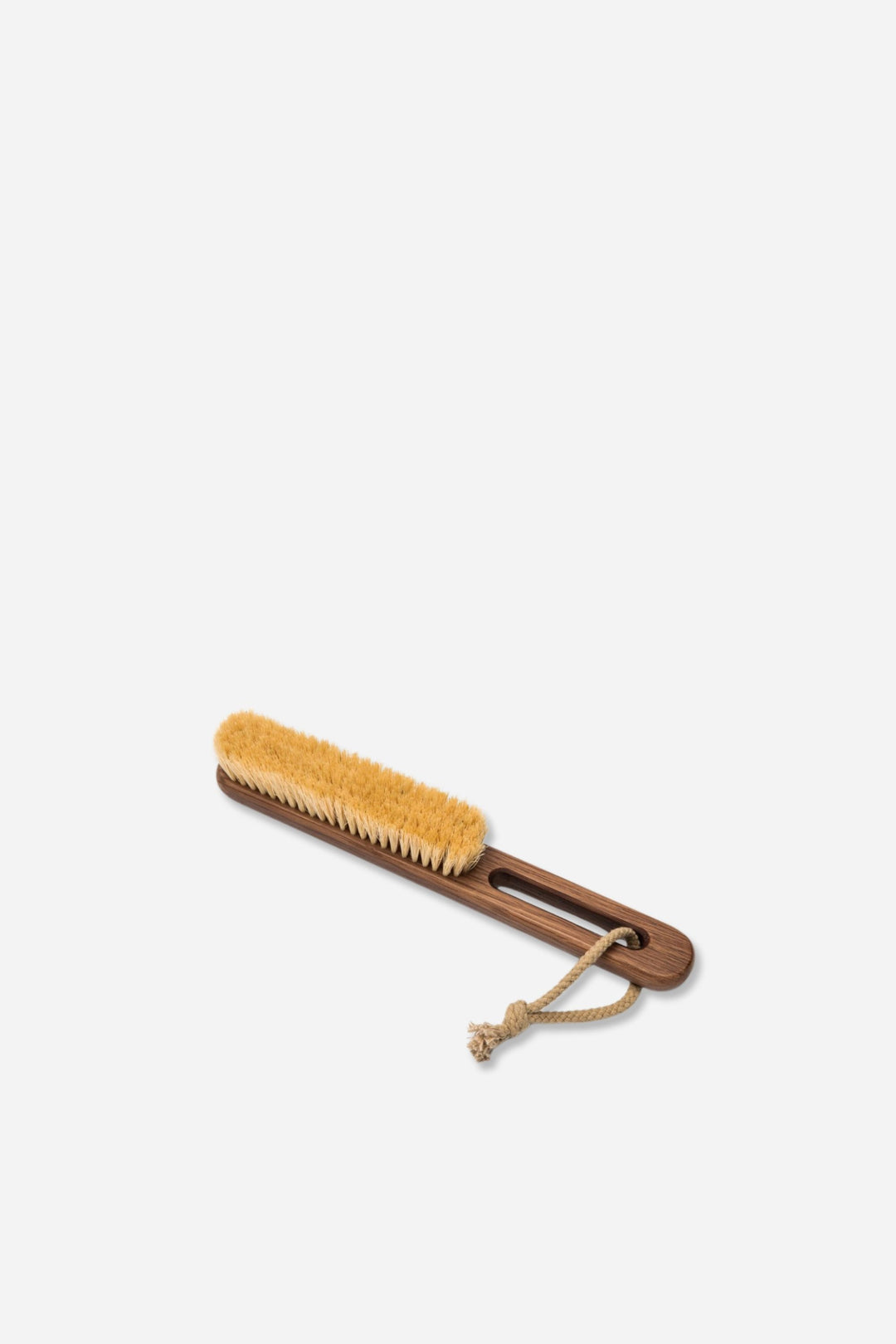 Wooden brush with bristle head on a white background