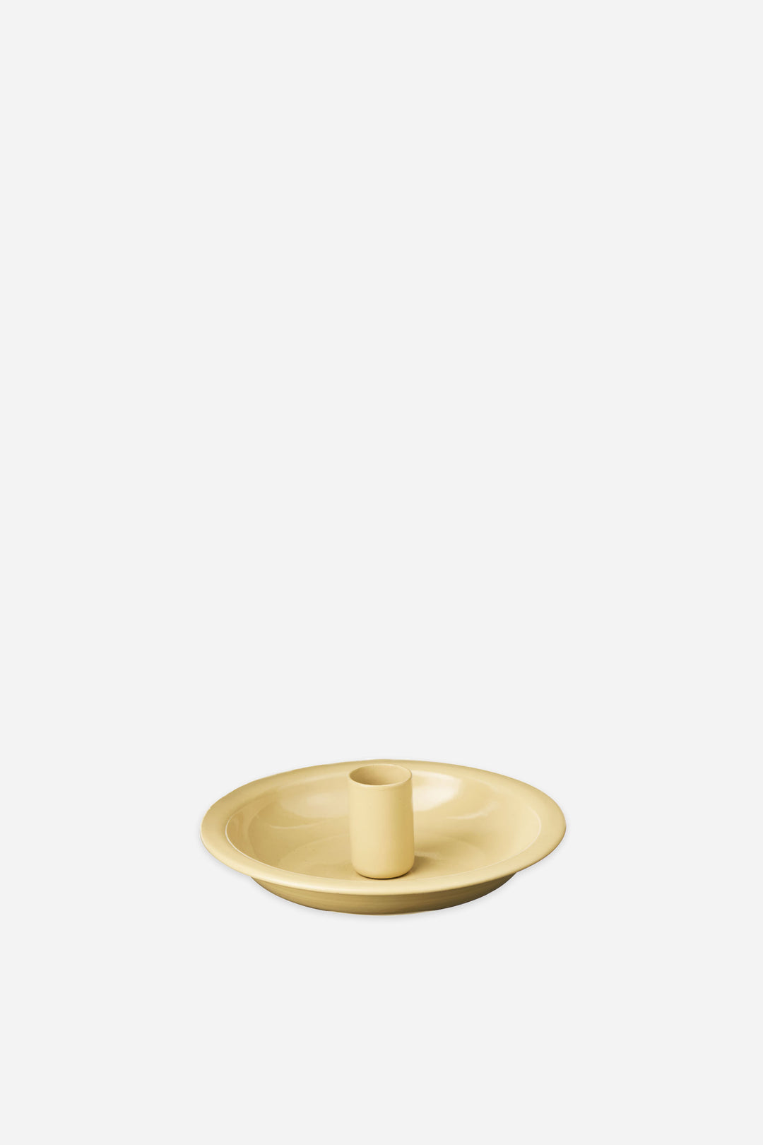 cream enamel taper candle holder on a white background