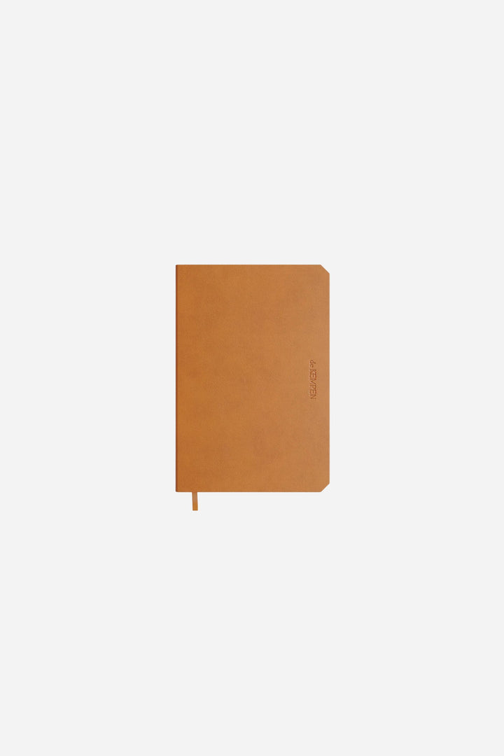 brown notebook on white backround